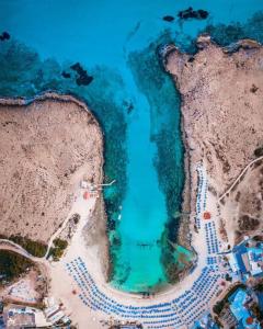 an aerial view of a body of water at Chrysomare Beach Hotel & Resort in Ayia Napa