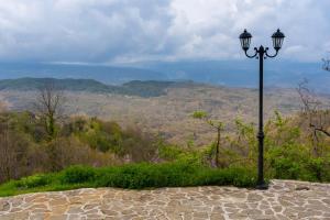 a street light sitting on top of a hill at Shamrock Elati Retreats in Elati Zagori