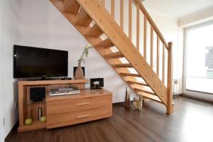 TV a/nebo společenská místnost v ubytování Haus Seemeile Wohnung 3 8