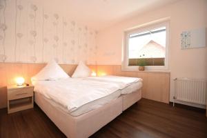 Postel nebo postele na pokoji v ubytování Haus Seemeile Wohnung 3 8
