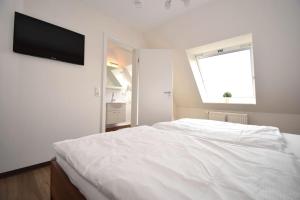 Postel nebo postele na pokoji v ubytování Haus Seemeile Wohnung 3 8