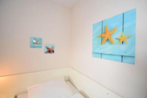 Postel nebo postele na pokoji v ubytování Haus Seemeile Wohnung 3 8