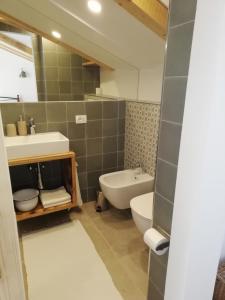 a bathroom with a sink and a toilet at Apartment Mauro in Baška