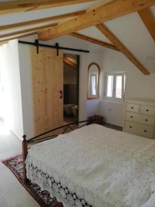 a bedroom with a large bed in a room at Apartment Mauro in Baška