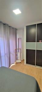 Łóżko lub łóżka w pokoju w obiekcie Apartamento Estudio Ruymar Jupiter