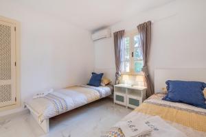 Posteľ alebo postele v izbe v ubytovaní Porto Cari 9 Apart Marina Cala dor