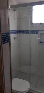 a bathroom with a glass shower with a toilet at ALVORADA PLACE in Santo André +25 photos