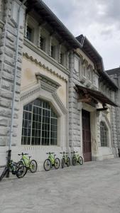 a group of bikes parked in front of a building at Locanda del Sasso Rooms in Crodo