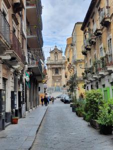 a city street with a church in the distance at CARLO'S Home in Catania