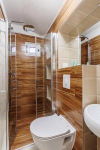 a bathroom with a toilet and a shower at HOUSE MIRKO- center of Split in Split +26 photos