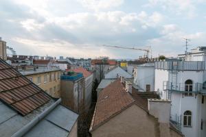 a view of a city with buildings and a crane at Milky Way Top Floor 2-bedroom Apartment air condition in Vienna