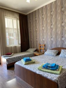 Postel nebo postele na pokoji v ubytování Уютный Дворик