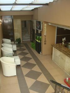 a lobby with toilets and a checkered floor at Guest House Lazur in Burgas