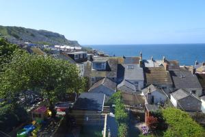 an aerial view of houses in a town next to the ocean at Cuddy in Castletown +37 photos