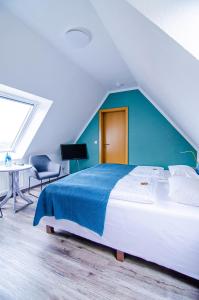 Postel nebo postele na pokoji v ubytování Hotel Blischke