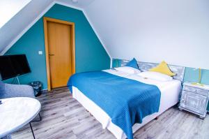 Postel nebo postele na pokoji v ubytování Hotel Blischke