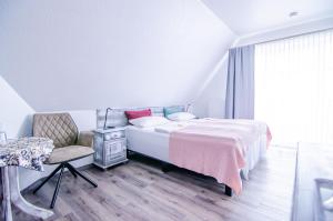 Postel nebo postele na pokoji v ubytování Hotel Blischke