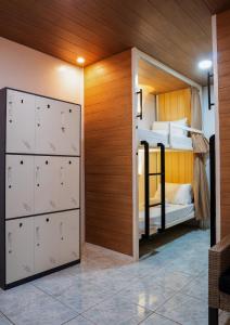 a room with two bunk beds and a closet at B&B Backpackers in Coron
