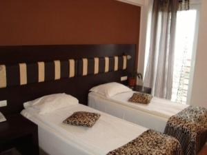Postel nebo postele na pokoji v ubytování Hotel Sydney