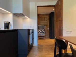 Kuchyň nebo kuchyňský kout v ubytování Boutique Apartments Bezau