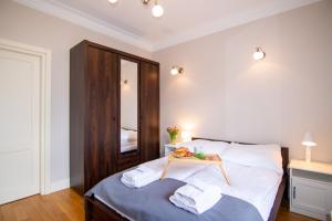 Posteľ alebo postele v izbe v ubytovaní Maya's Flats & Resorts - Staromiejski Apartments