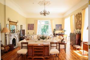a living room with a couch and a table at Annamult Country House Estate in Kilkenny