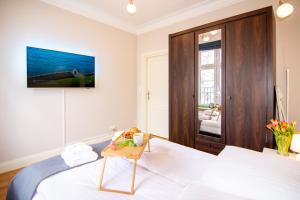 Posteľ alebo postele v izbe v ubytovaní Maya's Flats & Resorts - Staromiejski Apartments + 37 fotografií