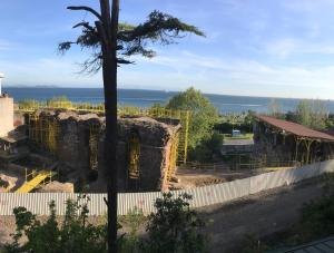 a building under construction with the ocean in the background at Marmara House&Apartments in Istanbul