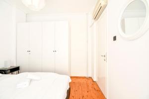 Postelja oz. postelje v sobi nastanitve Thessaloniki City Apartment Center