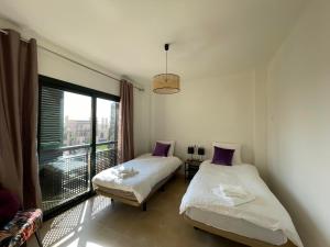 Ένα ή περισσότερα κρεβάτια σε δωμάτιο στο Casadeluxe El Oasis +13 φωτογραφίες