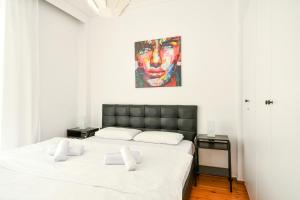 Posteľ alebo postele v izbe v ubytovaní Thessaloniki City Apartment Center
