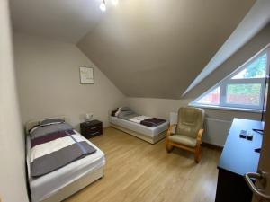 Postel nebo postele na pokoji v ubytování Korall Apartman