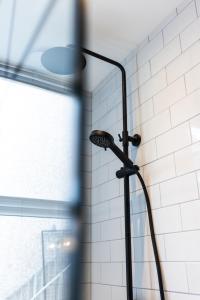 a shower head in the corner of a bathroom at Luxury Blackpool Apartments by Sasco in Blackpool
