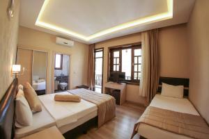 Postel nebo postele na pokoji v ubytování Payidar Hotel