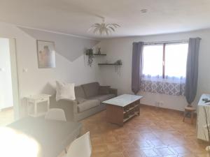 a living room with a couch and a table at la picarde in La Seyne-sur-Mer