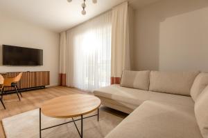 Televízia a/alebo spoločenská miestnosť v ubytovaní Resort Apartamenty Klifowa Rewal 79