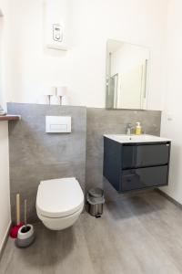 Phòng tắm tại Lahn-Living I - Gartenapartment - modern und hell