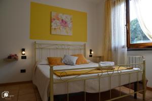A bed or beds in a room at Casa Verde Country House