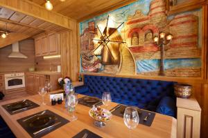 a dining room with a table with wine glasses at ВИЛА ТЪРТЕФФ in Nesebar