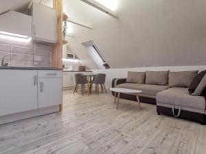 a living room with a couch and a table at Old Town Bakery in Marijampolė