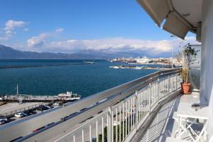a balcony with a view of the water at Superior Double Room with Stunning Sea View. DT in Patra