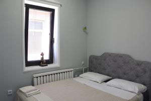 Un pat sau paturi într-o cameră la Hostel 42