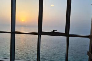a view of the ocean from the window of a cruise ship at full sea view 2 bhk apartment in Ajman 