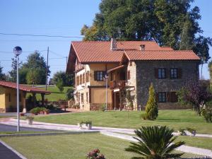a large stone house with a red roof at Hotel Rural Matsa in Lezama