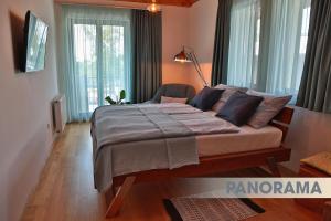 Postel nebo postele na pokoji v ubytování DV Premium Apartments