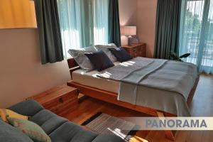Postel nebo postele na pokoji v ubytování DV Premium Apartments