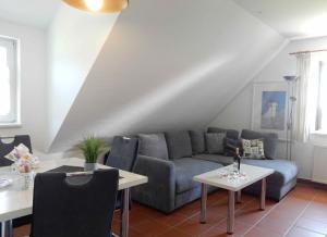 a living room with a couch and a table at Ferienparadies Rugana C09 in Kreptitz