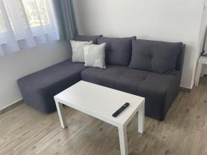 a living room with a couch and a white coffee table at Villa Mara in Pula