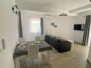 a living room with a couch and a table at Villa Mara in Pula