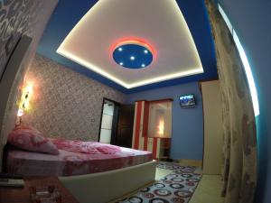 Hotel Buza 객실 침대
